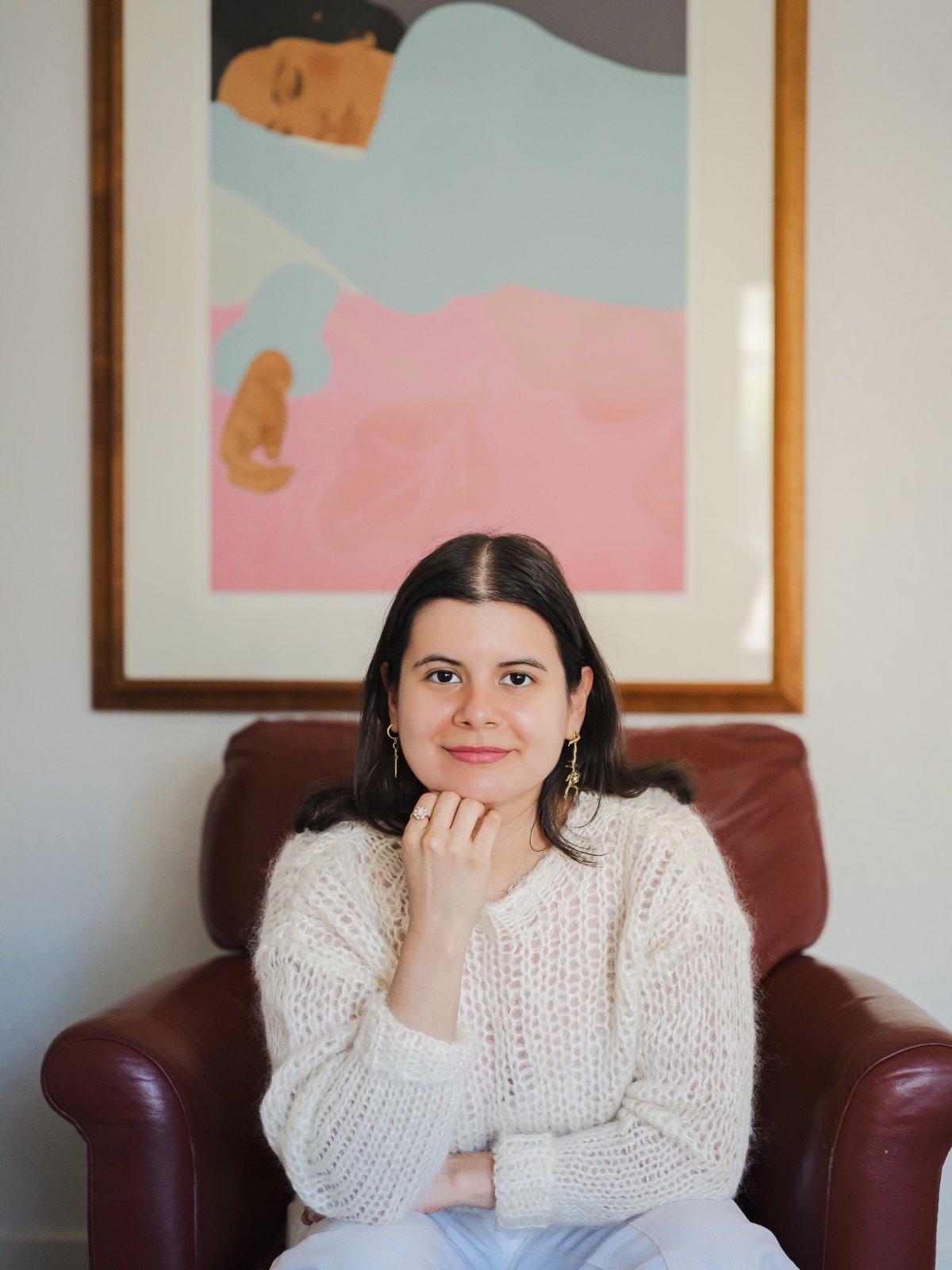 Cinthia Junco seated in her therapy room